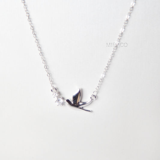 This beautifully crafted sterling silver necklace features a peaceful pigeon bird pendant, accented with a tiny diamond-style crystal for a soft, elegant shimmer. Available in both silver and rose gold finishes, this meaningful piece brings a sense of calm, love, and lightness to your everyday look.