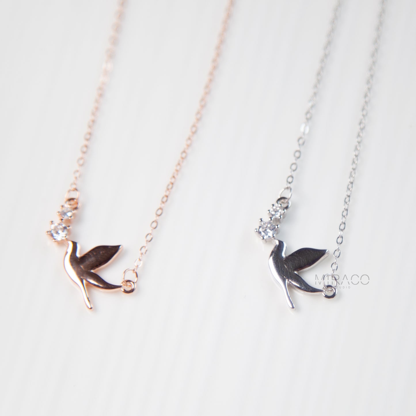 A Delicate Tribute to Freedom and Grace.
This beautifully crafted sterling silver necklace features a peaceful pigeon bird pendant, accented with a tiny diamond-style crystal for a soft, elegant shimmer. Available in both silver and rose gold finishes, this meaningful piece brings a sense of calm, love, and lightness to your everyday look.
Whether worn alone or layered, this necklace is a charming reminder of freedom, hope, and quiet strength.