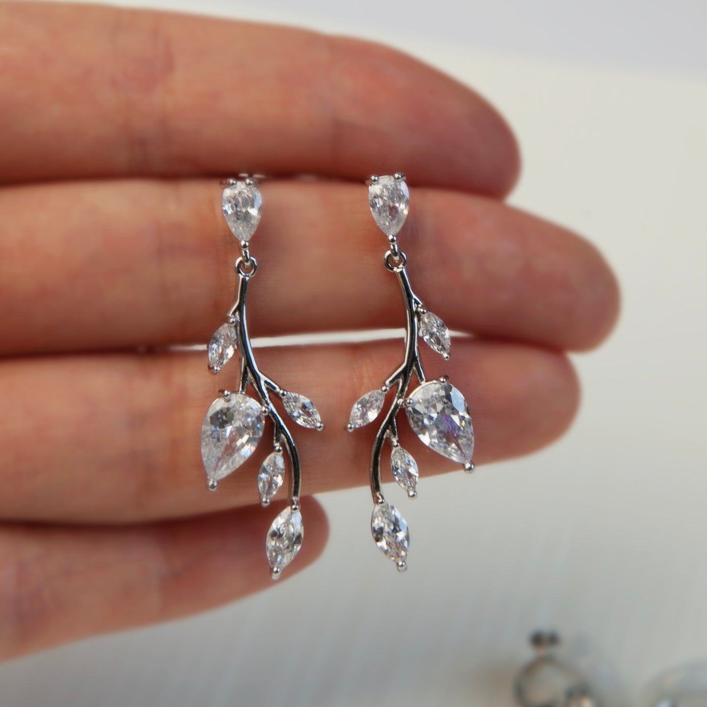 Clip On Diamond Earrings, Mini-Clip Dangle Earrings, Non-Pierced Plant Bridal Wedding Earrings
Our Mini-Clip Dangle Earrings are the perfect choice for those seeking subtle elegance or with small earlobes. Enjoy stylish charm and comfort in a compact design.