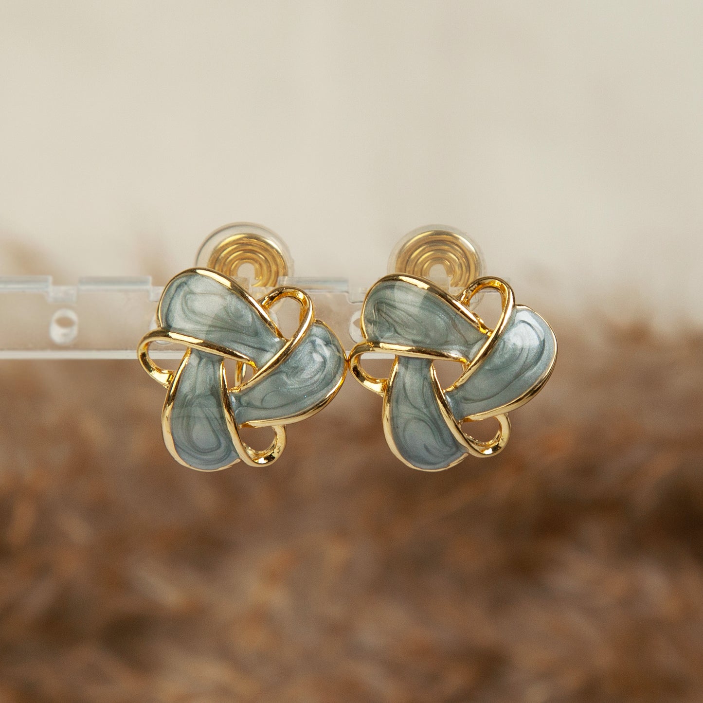 Clip On Stud Earrings Gold-Tone Blue Knot Geometric Earrings, Non Pierced Stud Earrings, Twist Knot Stud Earrings, Medium Blue-gray Studs
