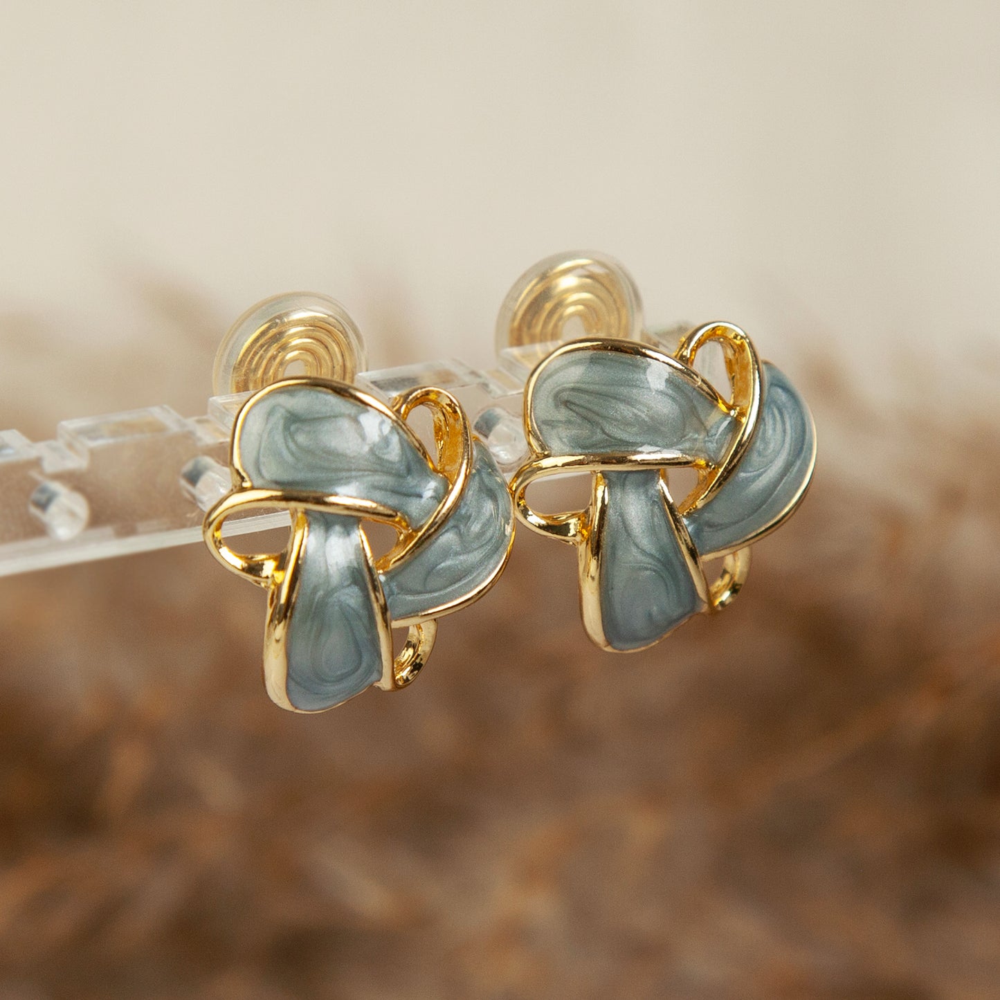 Clip On Stud Earrings Gold-Tone Blue Knot Geometric Earrings, Non Pierced Stud Earrings, Twist Knot Stud Earrings, Medium Blue-gray Studs