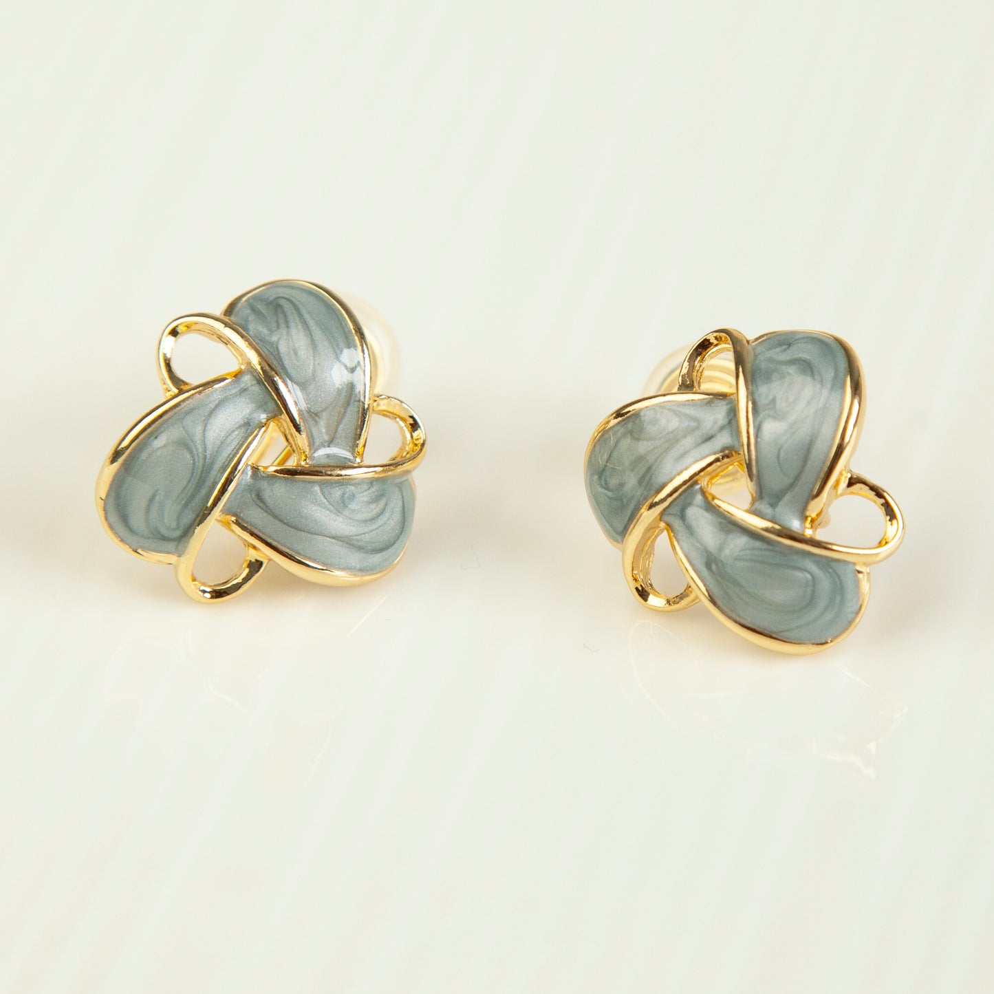 Clip On Stud Earrings Gold-Tone Blue Knot Geometric Earrings, Non Pierced Stud Earrings, Twist Knot Stud Earrings, Medium Blue-gray Studs