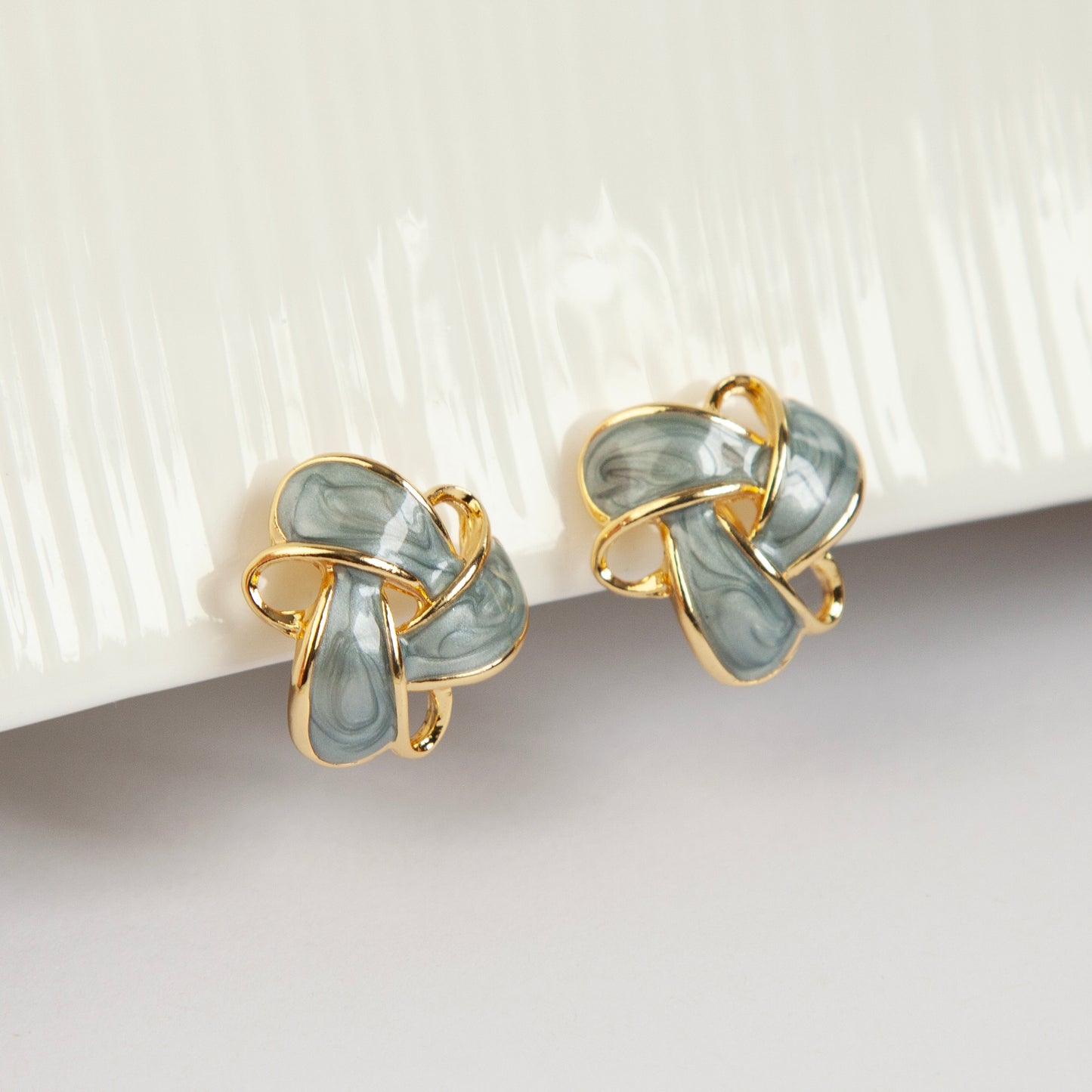 Clip On Stud Earrings Gold-Tone Blue Knot Geometric Earrings, Non Pierced Stud Earrings, Twist Knot Stud Earrings, Medium Blue-gray Studs