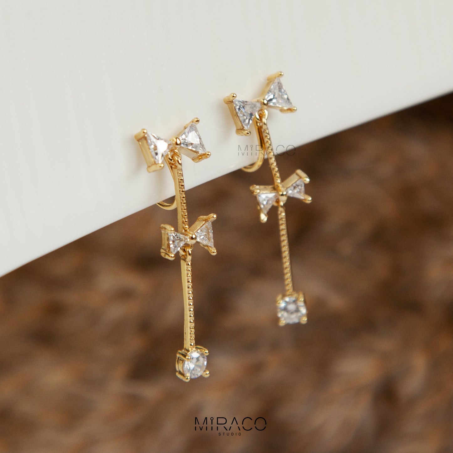 Gold Bow Dangle Clip-On Earrings with CZ Crystals