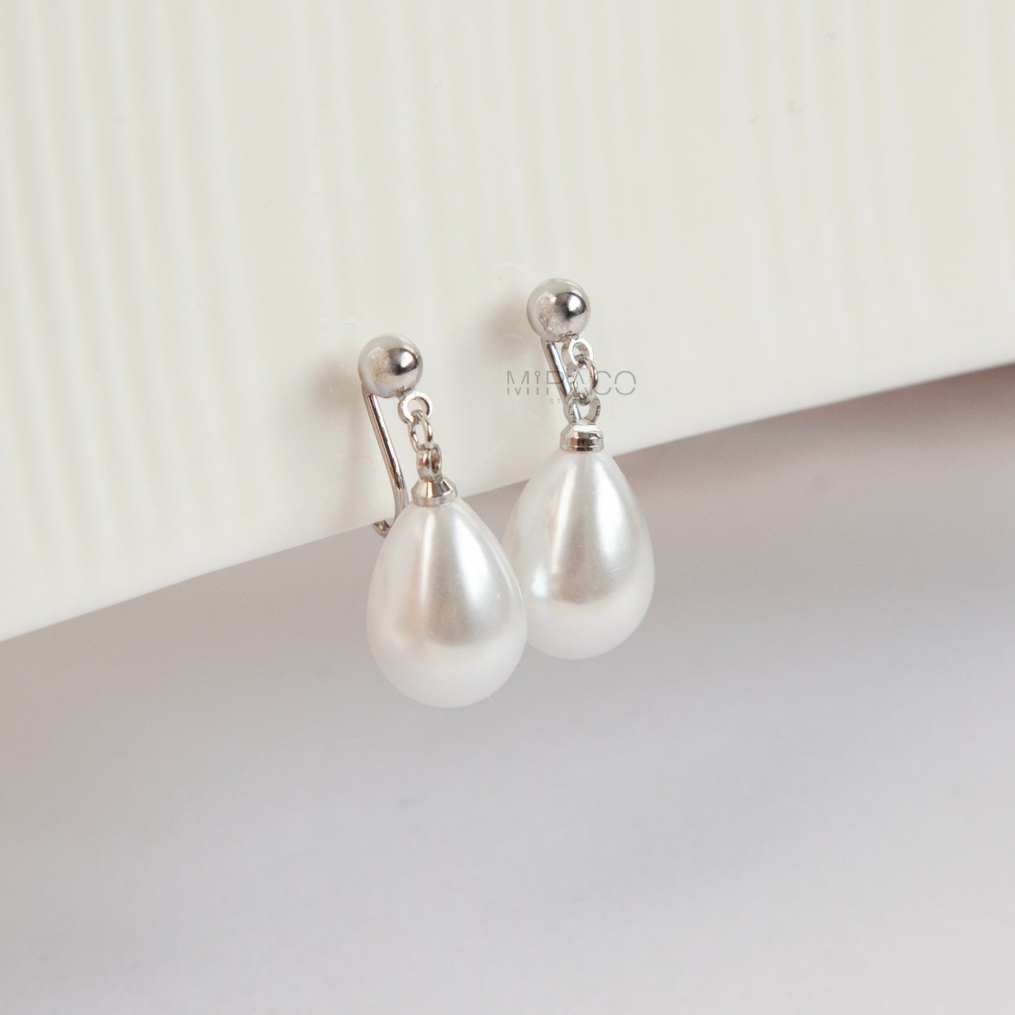 handmade clip on earrings with white teardrop pearls