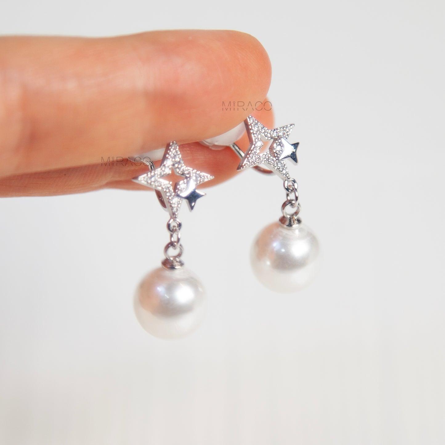 Silver Star Clip-On Earrings with Pearl Drop