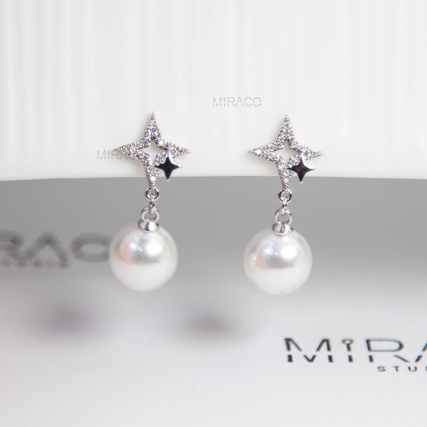 Silver Star Clip-On Earrings with Pearl Drop