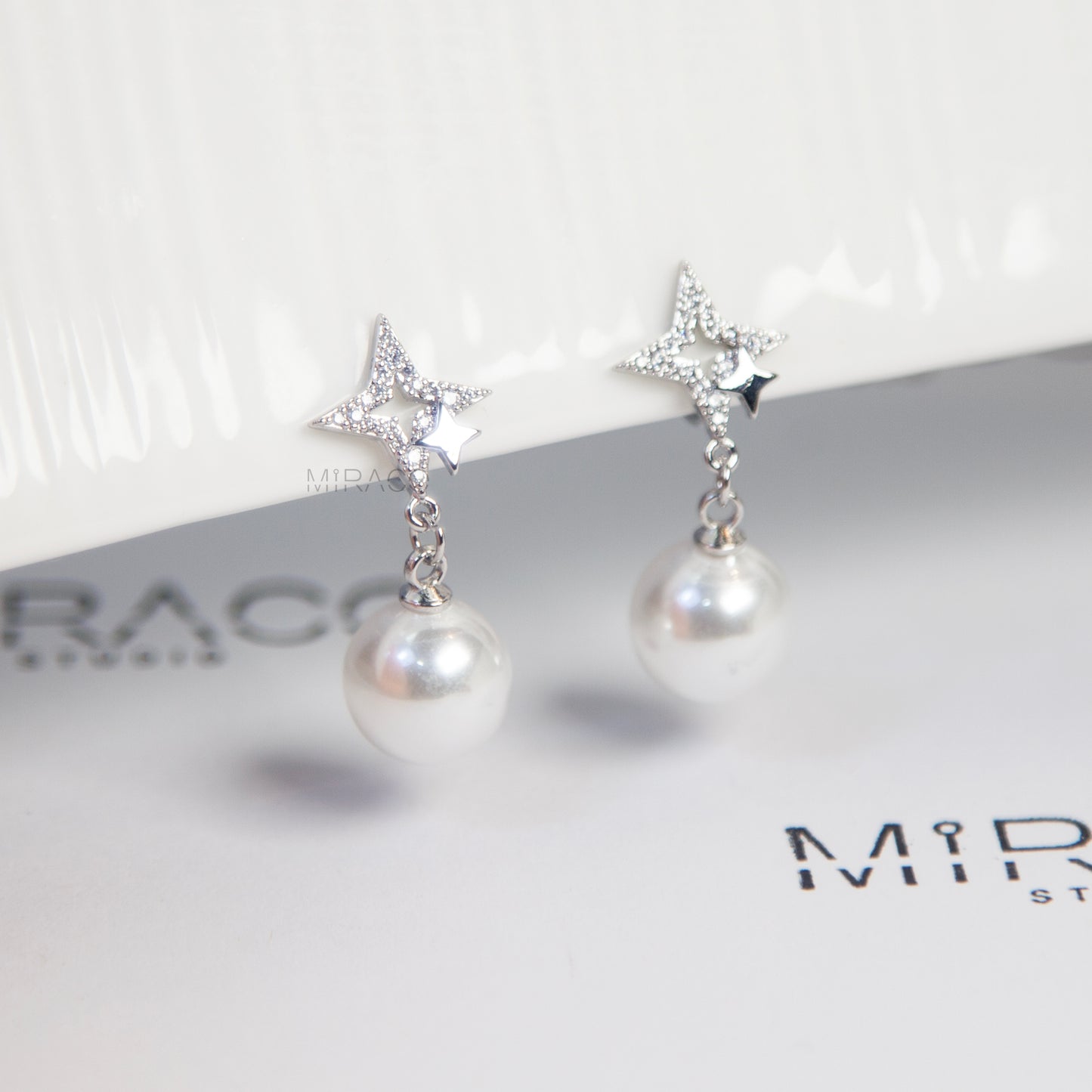 Silver Star Clip-On Earrings with Pearl Drop
