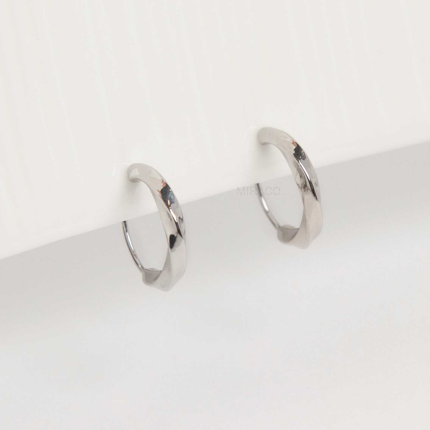 silver clip-on hoop earrings, twisted hoop earrings, 18mm hoop clip-ons, non pierced silver earrings, small silver hoops clip-on, everyday hoop earrings, coil clip-on earrings, classic hoop earrings no piercing
