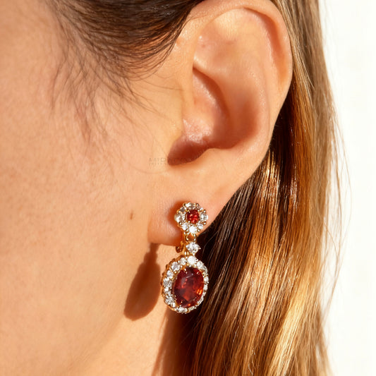 uby red clip-on earrings, ruby crystal drop earrings, red oval clip-on earrings, gold ruby clip-on earrings, ruby red dangle earrings non pierced, ruby clip-on earrings for weddings, ruby red statement earrings, ruby red ear clips, ruby red evening earrings non pierced, crystal halo clip-on earrings, ruby inspired jewellery clip ons