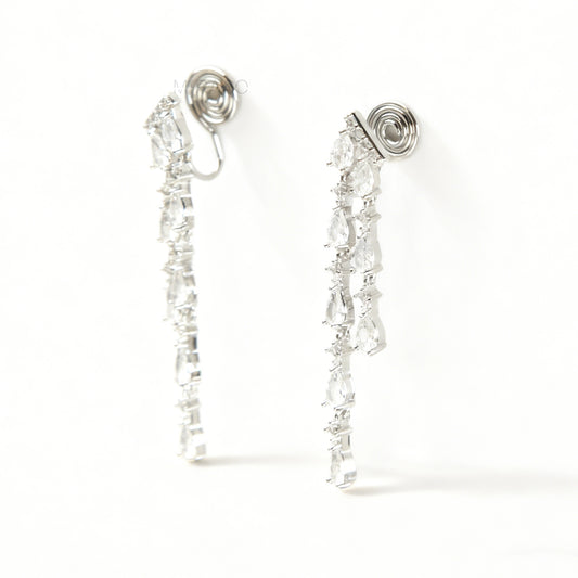 Long, silver-tone dangle clip-on earrings featuring cascading strands of clear (white) and pink pear-shaped and round-cut cubic zirconia stones.