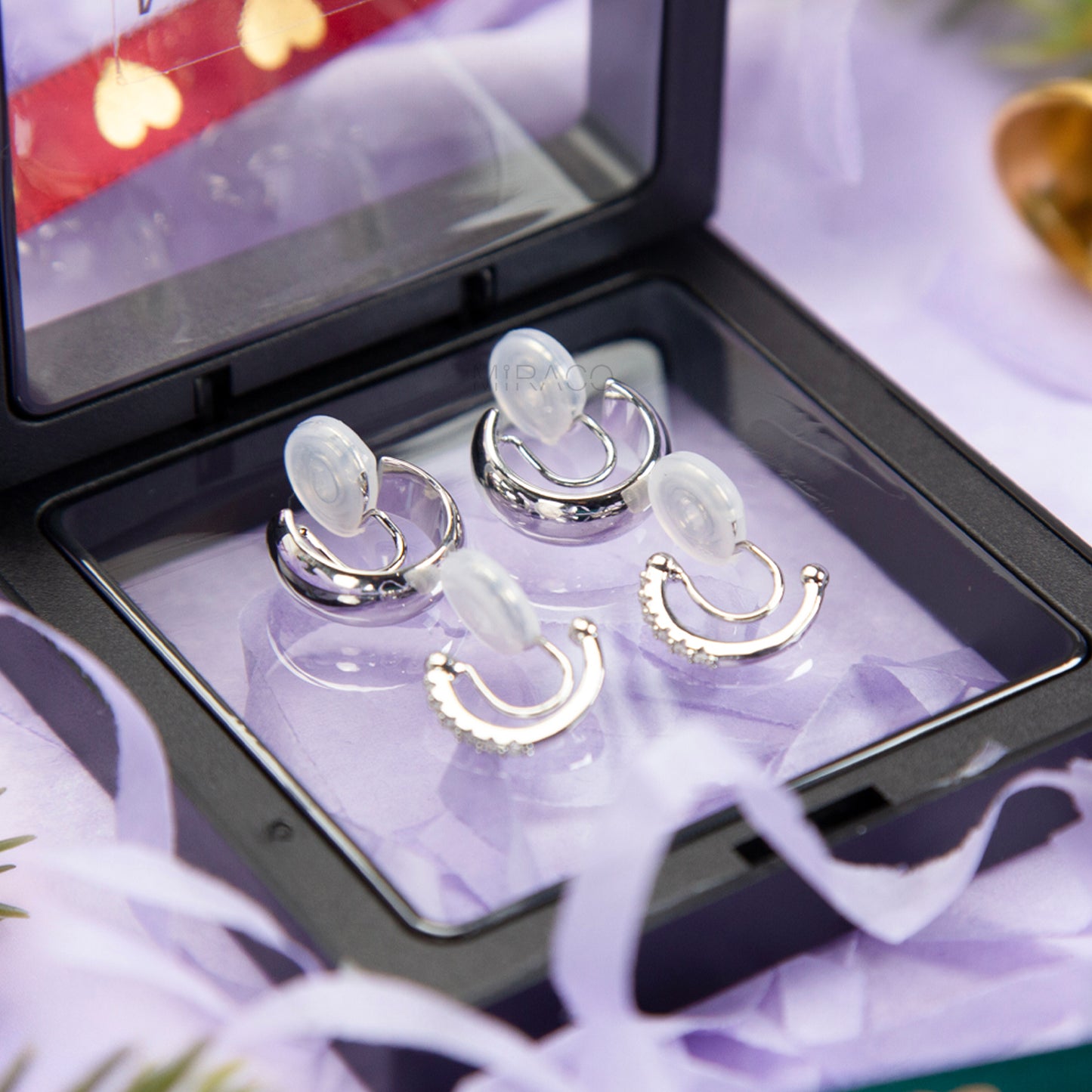 Silver minimalist clip-on hoop earrings set with two simple hoop styles for non-pierced ears.