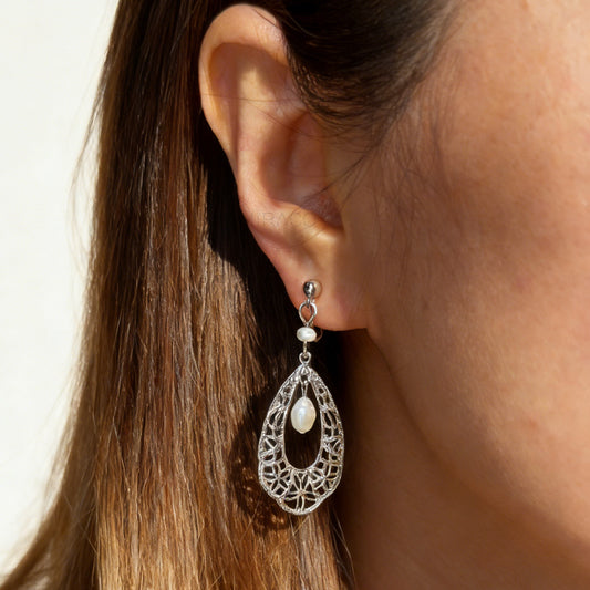 Silver filigree teardrop clip-on earrings with freshwater pearl drop and comfortable coil back for non-pierced ears