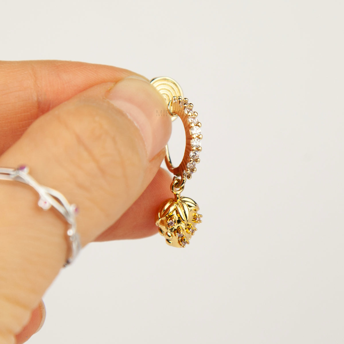 gold-plated strawberry clip-on hoop earrings with pavé cubic zirconia and a comfortable coil back for non-pierced ears.