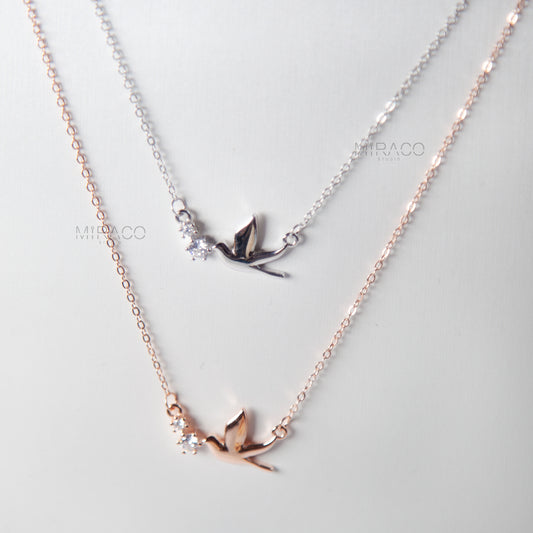 A Delicate Tribute to Freedom and Grace.

This beautifully crafted sterling silver necklace features a peaceful pigeon bird pendant, accented with a tiny diamond-style crystal for a soft, elegant shimmer. Available in both silver and rose gold finishes, this meaningful piece brings a sense of calm, love, and lightness to your everyday look.

Whether worn alone or layered, this necklace is a charming reminder of freedom, hope, and quiet strength.