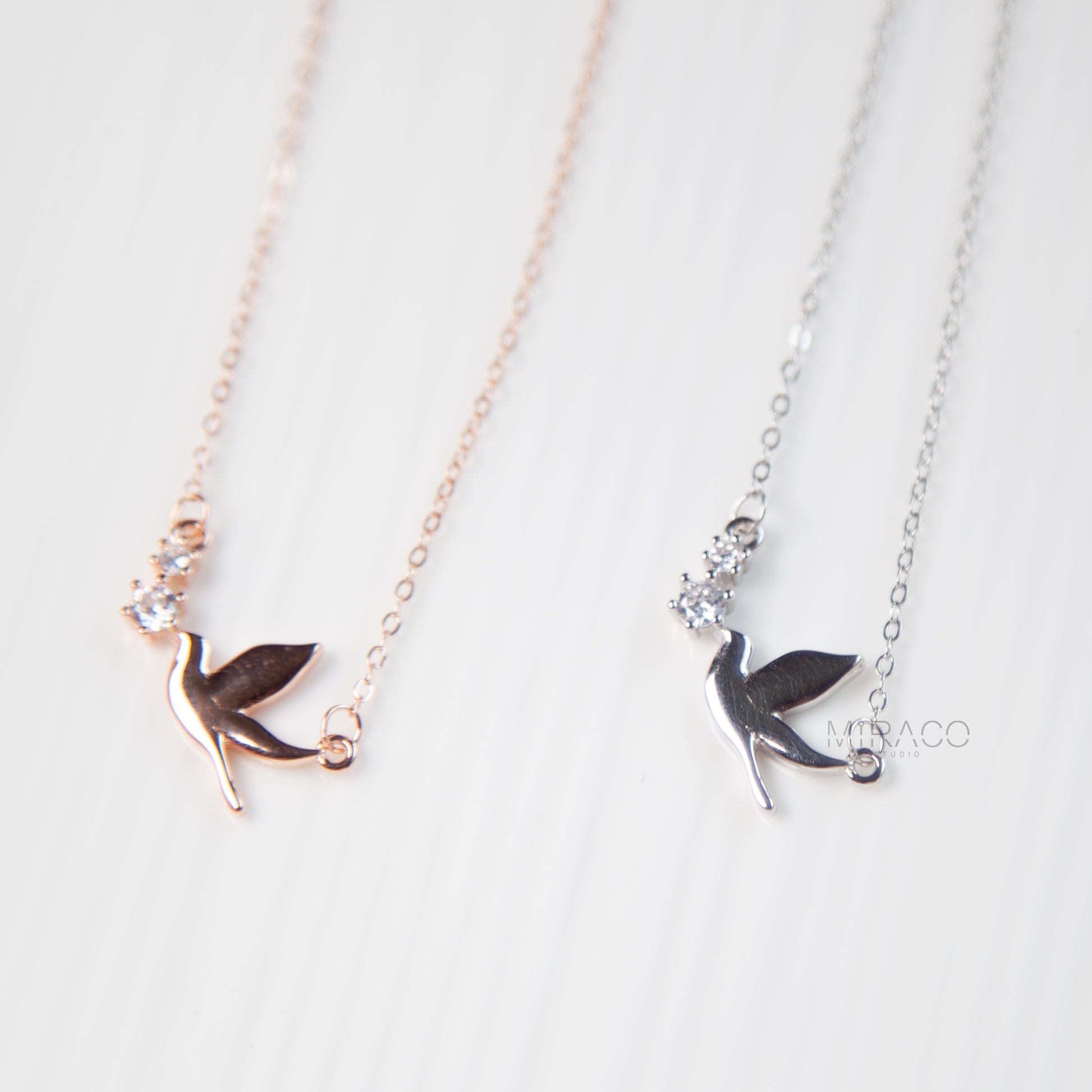 A Delicate Tribute to Freedom and Grace.

This beautifully crafted sterling silver necklace features a peaceful pigeon bird pendant, accented with a tiny diamond-style crystal for a soft, elegant shimmer. Available in both silver and rose gold finishes, this meaningful piece brings a sense of calm, love, and lightness to your everyday look.

Whether worn alone or layered, this necklace is a charming reminder of freedom, hope, and quiet strength.