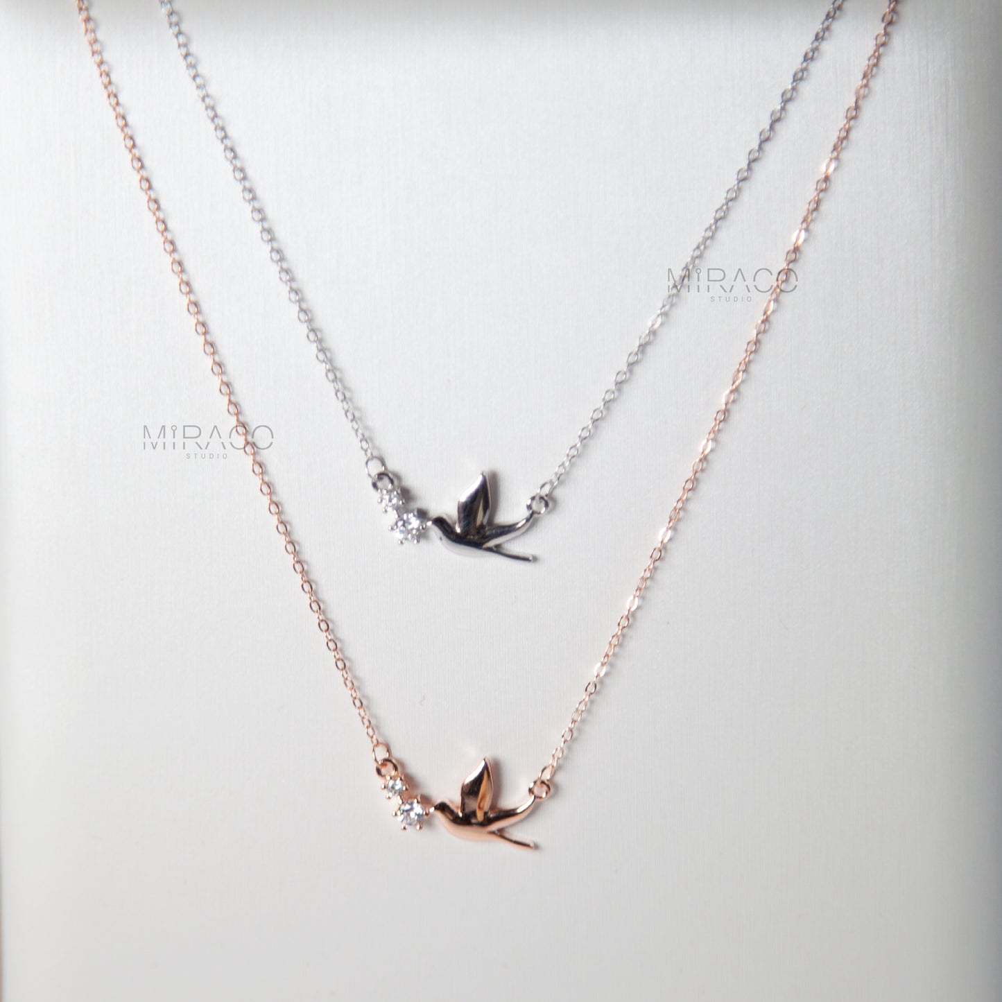 A Delicate Tribute to Freedom and Grace.

This beautifully crafted sterling silver necklace features a peaceful pigeon bird pendant, accented with a tiny diamond-style crystal for a soft, elegant shimmer. Available in both silver and rose gold finishes, this meaningful piece brings a sense of calm, love, and lightness to your everyday look.

Whether worn alone or layered, this necklace is a charming reminder of freedom, hope, and quiet strength.