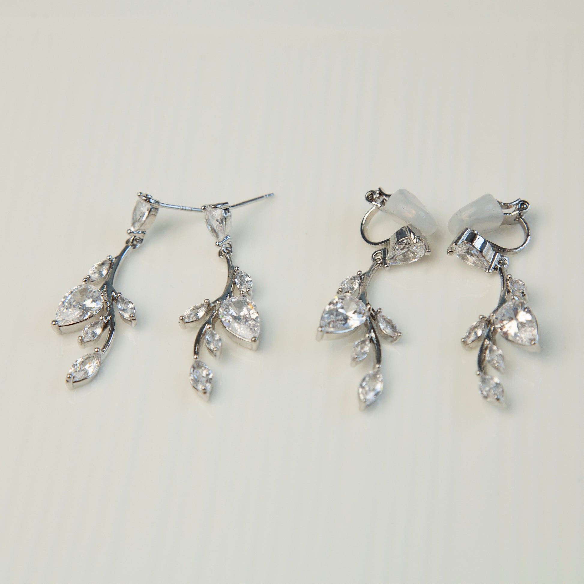 Clip On Diamond Earrings, Mini-Clip Dangle Earrings, Non-Pierced Plant Bridal Wedding Earrings

Our Mini-Clip Dangle Earrings are the perfect choice for those seeking subtle elegance or with small earlobes. Enjoy stylish charm and comfort in a compact design.