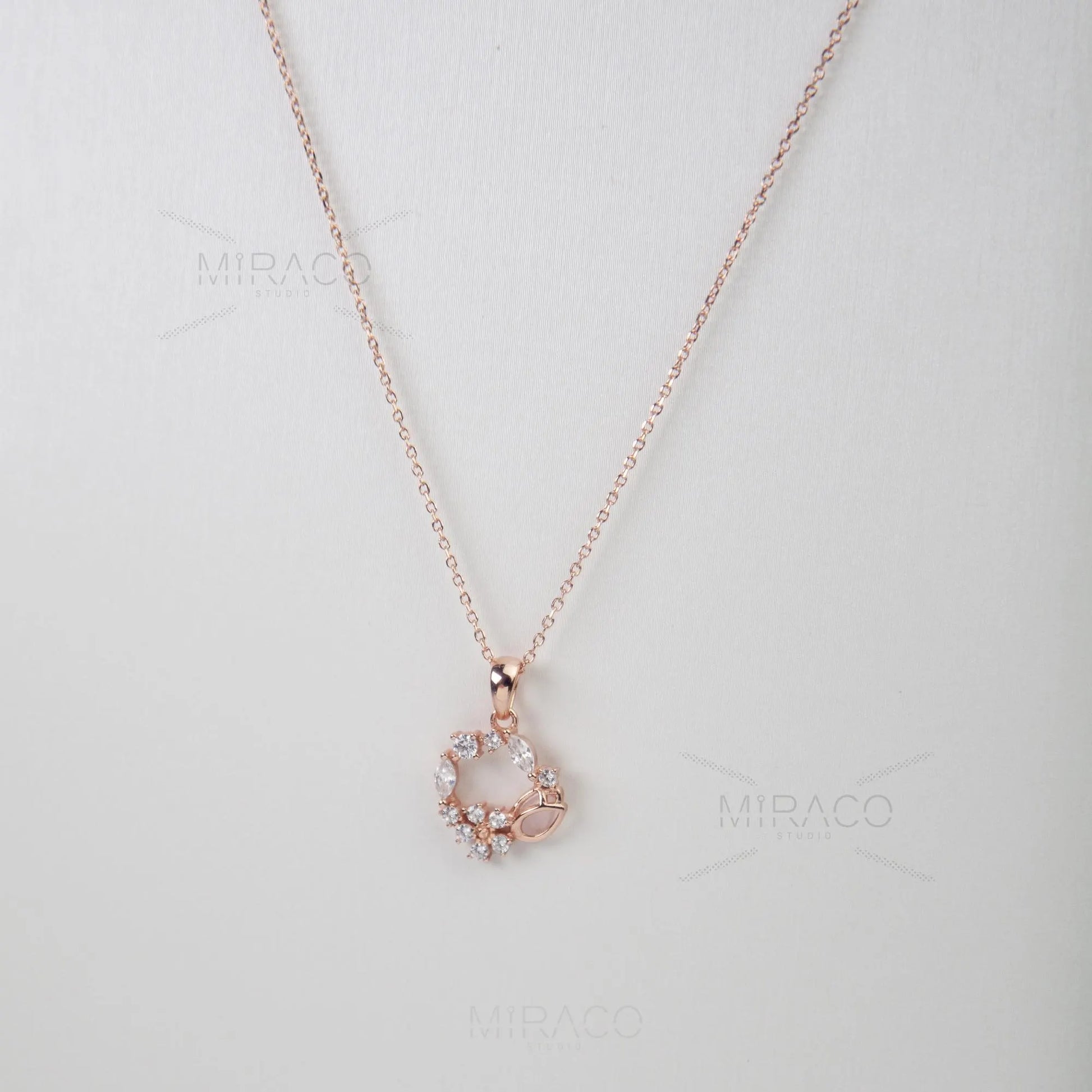 Discover enchanting elegance with our Flower Wreath Necklace. Crafted from high-quality, genuine&nbsp;925 sterling silver&nbsp;and finished with a warm&nbsp;rose gold color, this piece offers both durability and on-trend style.