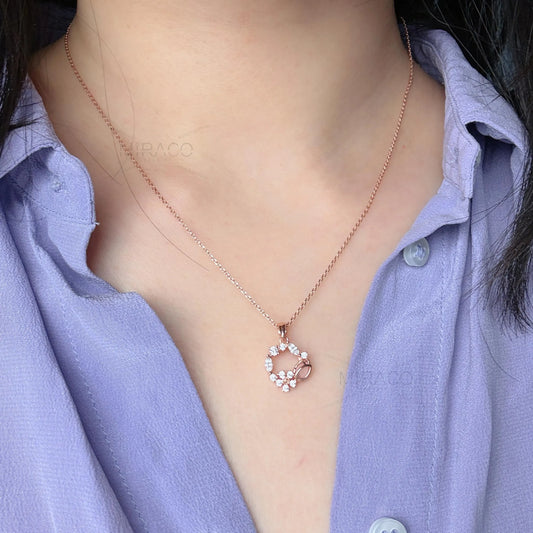Discover enchanting elegance with our Flower Wreath Necklace. Crafted from high-quality, genuine&nbsp;925 sterling silver&nbsp;and finished with a warm&nbsp;rose gold color, this piece offers both durability and on-trend style.