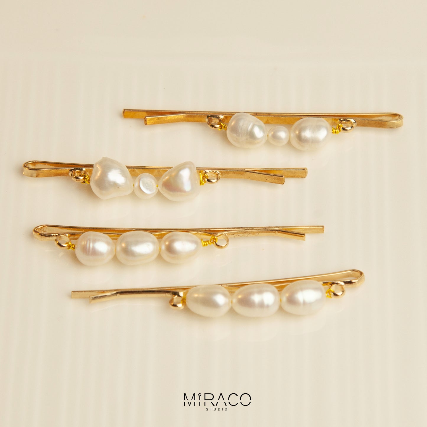 Gold-Toned Pearl Barrette with Irregular Shaped Pearls, Bridal Hair Clips Wedding Hair Accessories

• Materials: freshwater pearls

• Size:&nbsp;
A: 60mm pin with three sames size pearls 7-8mm freshwater pearls
B: 60mm pin with bowknot shape two 7-8mm one small 4-5mm freshwater pearls

• Sold as a set of 2 clips

Please note every single pearls are unique with nature flaws, not in perfect round shape.&nbsp;