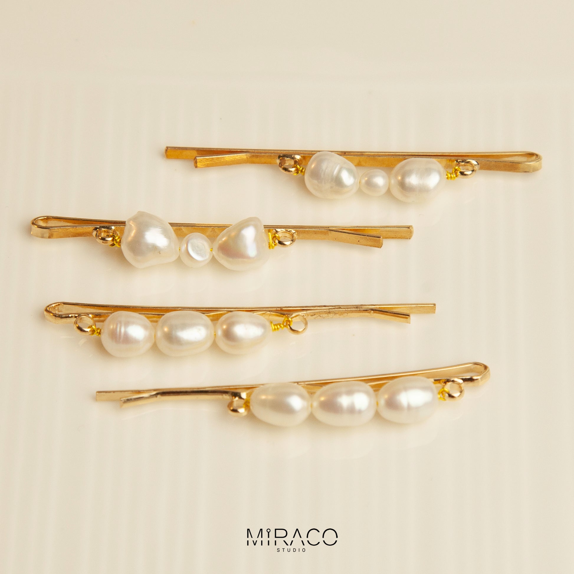 Gold-Toned Pearl Barrette with Irregular Shaped Pearls, Bridal Hair Clips Wedding Hair Accessories

• Materials: freshwater pearls

• Size:&nbsp;
A: 60mm pin with three sames size pearls 7-8mm freshwater pearls
B: 60mm pin with bowknot shape two 7-8mm one small 4-5mm freshwater pearls

• Sold as a set of 2 clips

Please note every single pearls are unique with nature flaws, not in perfect round shape.&nbsp;