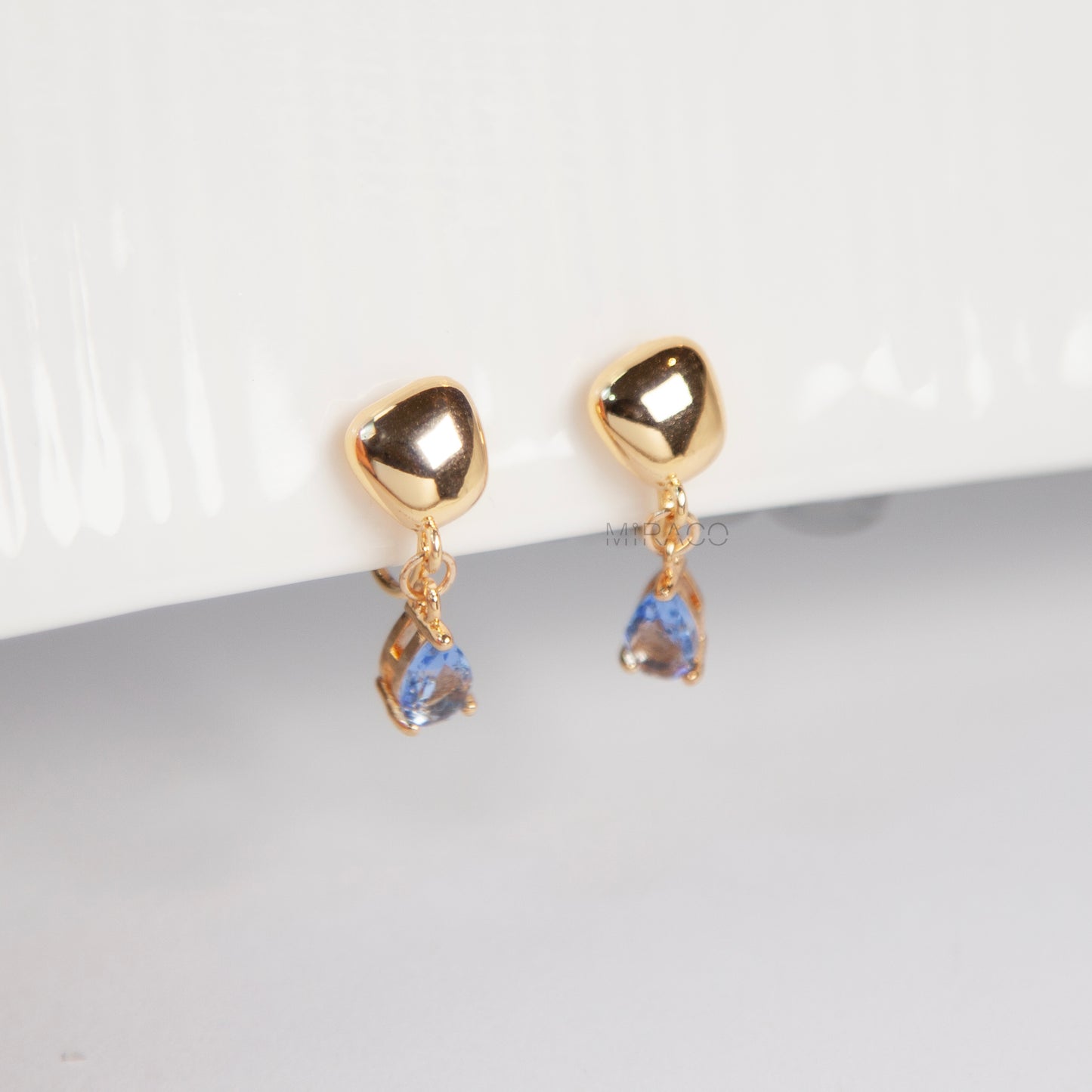 Modern Gold Clip-On Earrings – Blue Teardrop Crystal Dangle