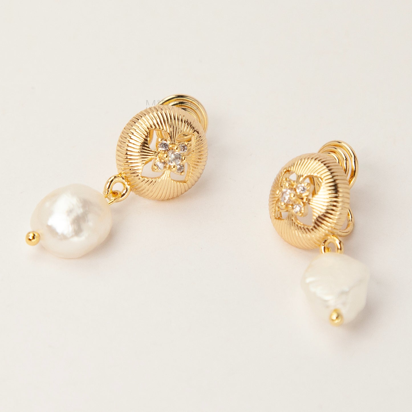 Gold plated baroque pearl dangle clip-on earrings with secure coil back closure for non-pierced ears