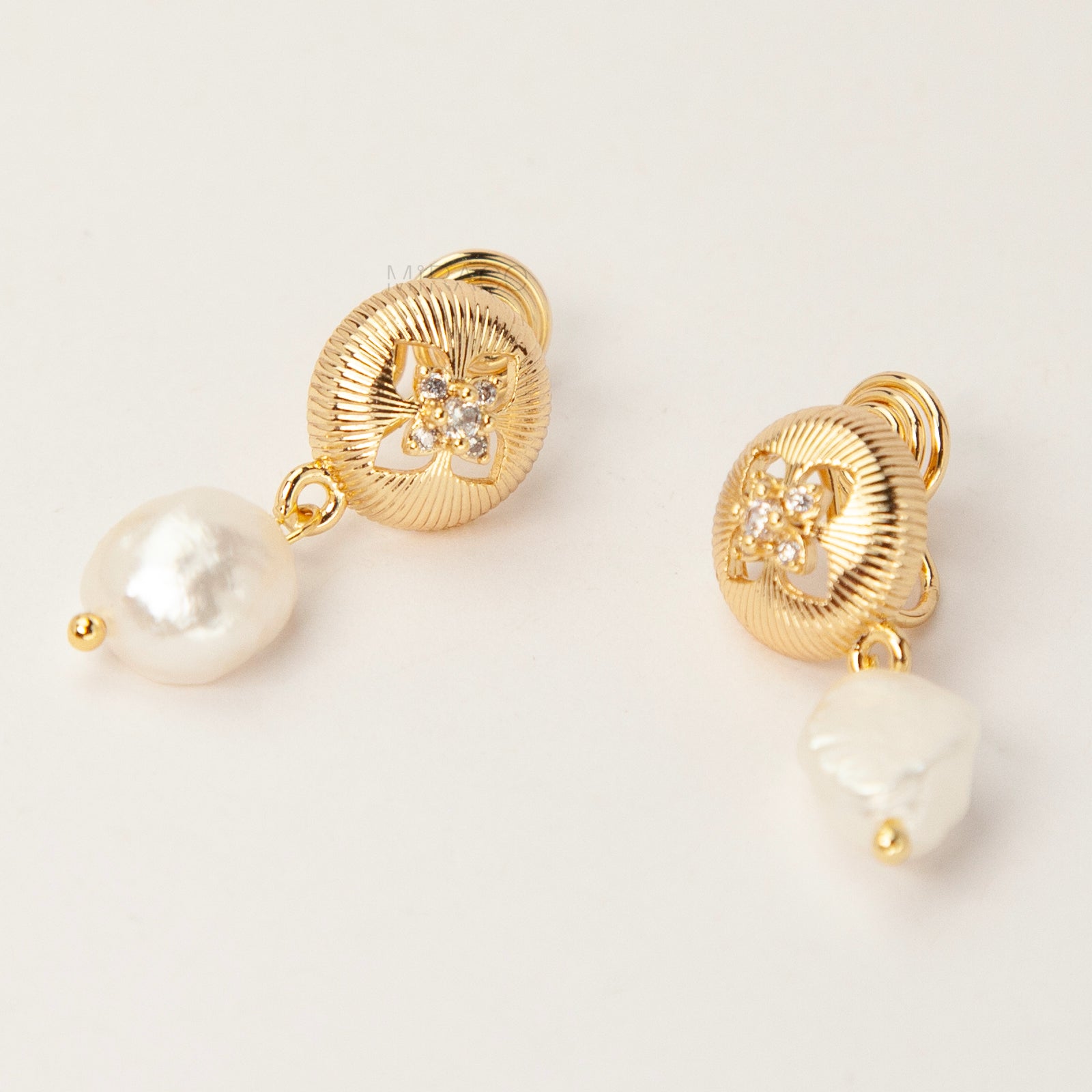 Gold plated baroque pearl dangle clip-on earrings with secure coil back closure for non-pierced ears