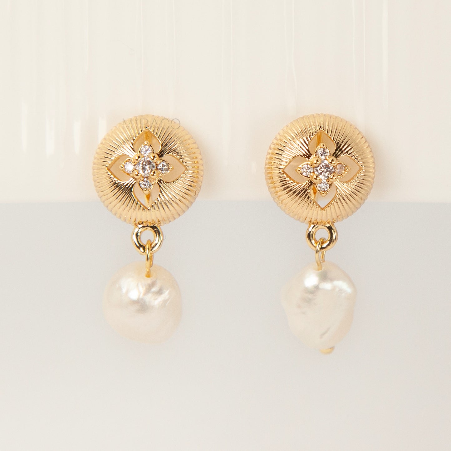 Gold plated baroque pearl dangle clip-on earrings with secure coil back closure for non-pierced ears