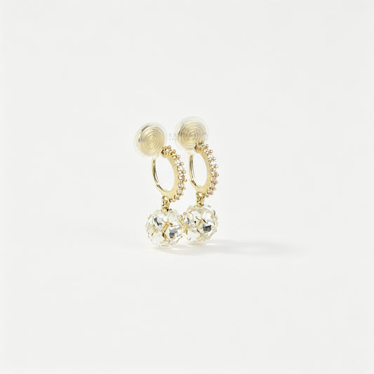 Pair of gold-toned non-pierced clip-on hoop earrings with pavé crystals, clear faceted glass sphere drops, and spiral coil backs with silicone pads.