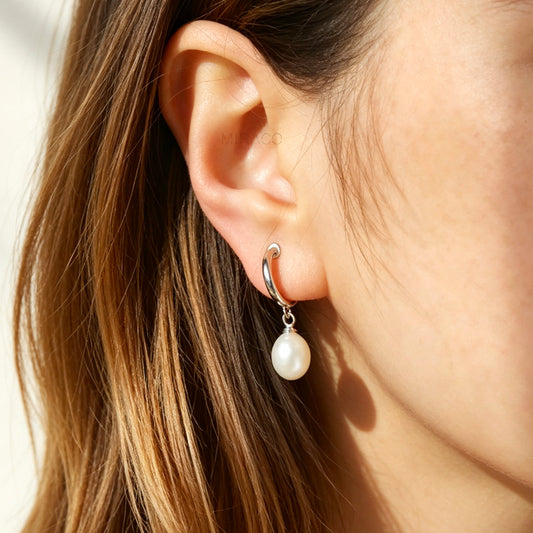 non-pierced silver hoop clip-on earrings featuring real dangling freshwater pearls and clear comfortable coil-back cushions