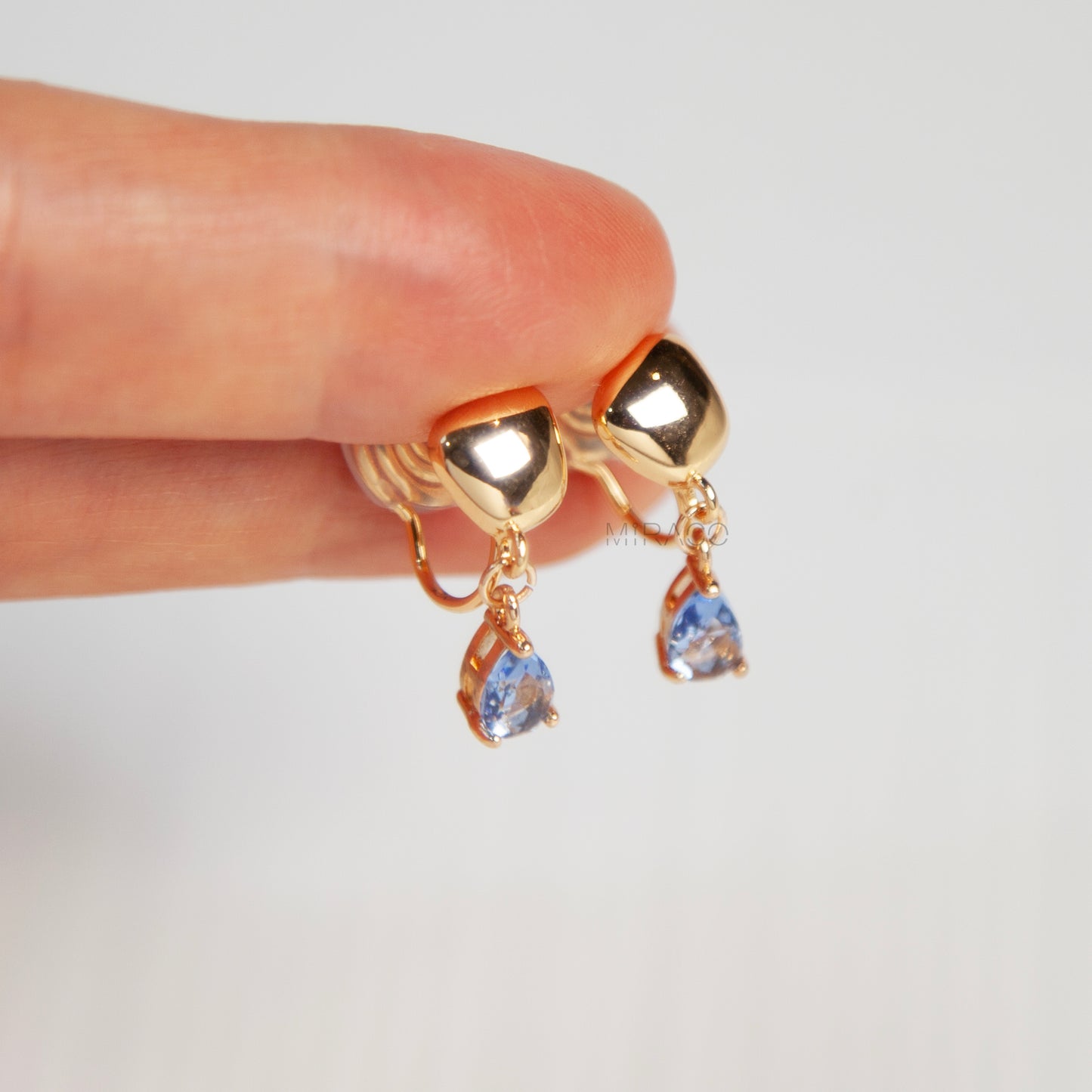 Modern Gold Clip-On Earrings – Blue Teardrop Crystal Dangle