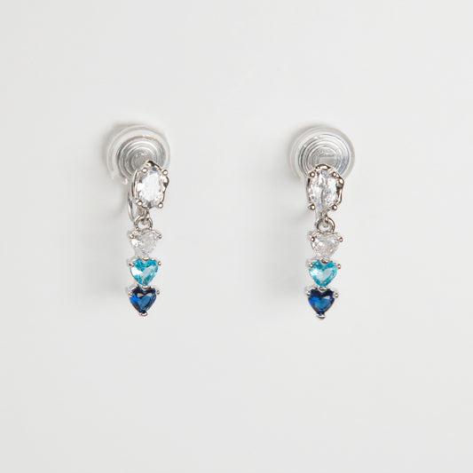 Pair of clip on earrings with heart-shaped gemstones, blue and white gem stone