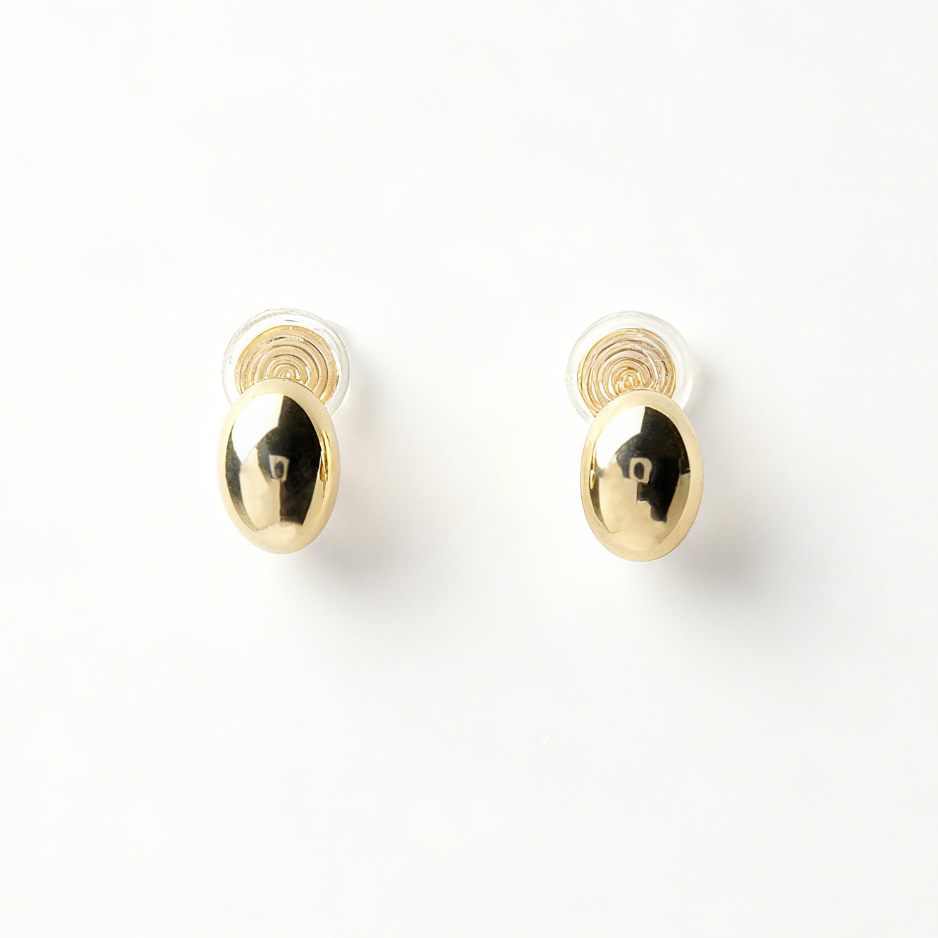 clip-on earrings, silver clip-on earrings, gold clip-on earrings, oval stud earrings, minimalist earrings, non-pierced earrings, U-shape coil clip-on, everyday stud earrings, polished oval earrings, lightweight clip-on earrings