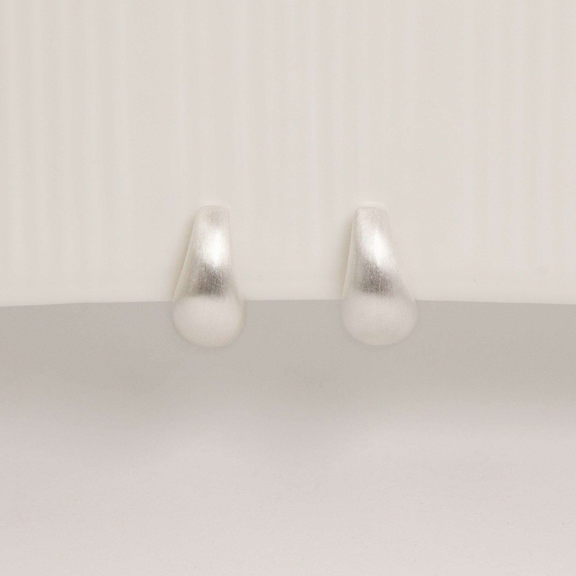 brushed silver clip-on earrings, dome hoop clip-ons, silver coil back earrings, non pierced hoop earrings, matte silver hoop earrings, clip-on everyday earrings, brushed finish earrings, classic silver dome hoops