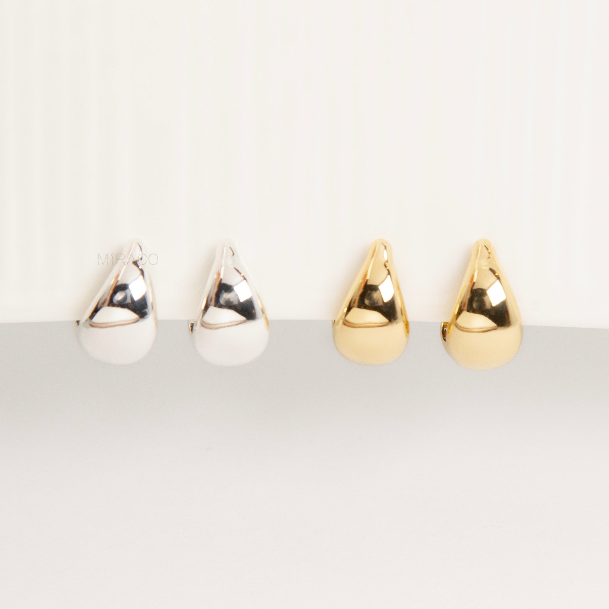 teardrop clip-on hoop earrings, dome hoop earrings silver gold, non pierced clip-on earrings, coil back teardrop earrings, gold clip-on hoops, silver dome hoops, teardrop earrings without piercing, classic everyday clip-ons