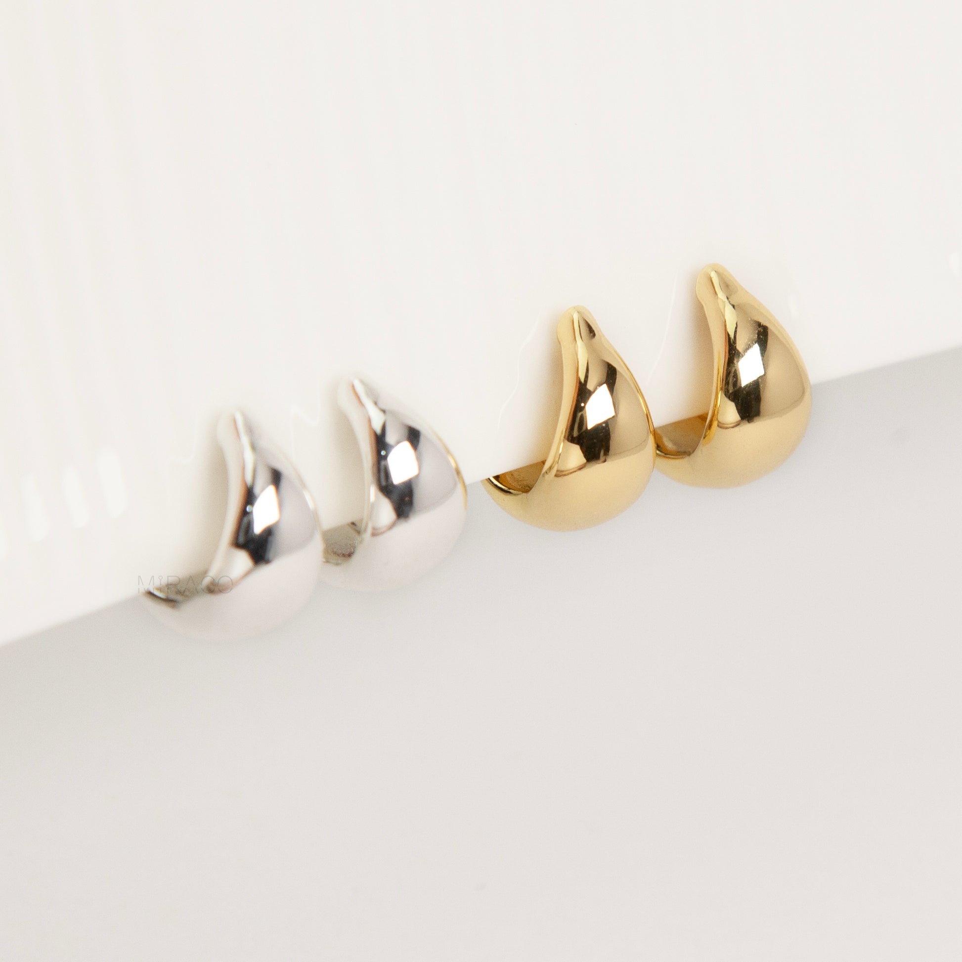 teardrop clip-on hoop earrings, dome hoop earrings silver gold, non pierced clip-on earrings, coil back teardrop earrings, gold clip-on hoops, silver dome hoops, teardrop earrings without piercing, classic everyday clip-ons