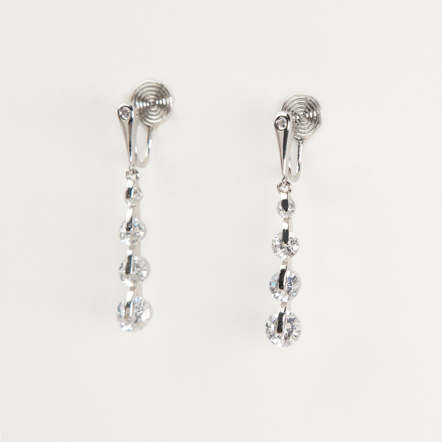silver dangle clip-on earrings, non pierced diamond drop earrings, crystal clip on earrings, silver coil back earrings, dangling clip on earrings
