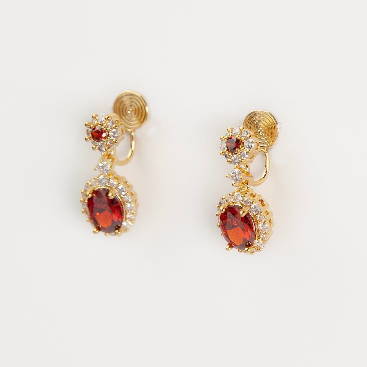 uby red clip-on earrings, ruby crystal drop earrings, red oval clip-on earrings, gold ruby clip-on earrings, ruby red dangle earrings non pierced, ruby clip-on earrings for weddings, ruby red statement earrings, ruby red ear clips, ruby red evening earrings non pierced, crystal halo clip-on earrings, ruby inspired jewellery clip ons
