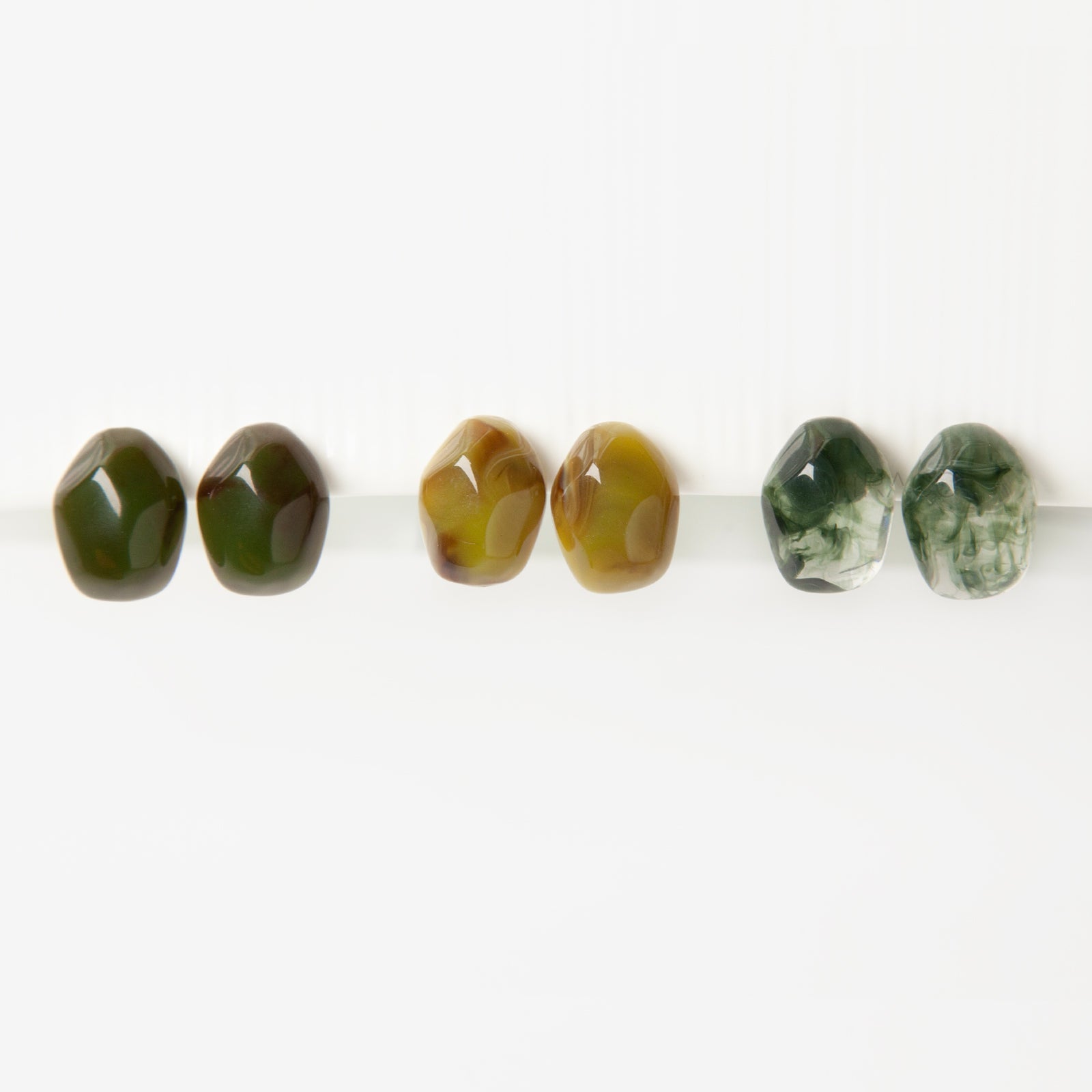 chunky resin clip on earrings, stone effect clip on earrings, non pierced stud earrings, resin stud earrings coil back, green clip on earrings, amber brown clip on studs, marbled clip on earrings, bold clip on earrings, modern clip on earrings
