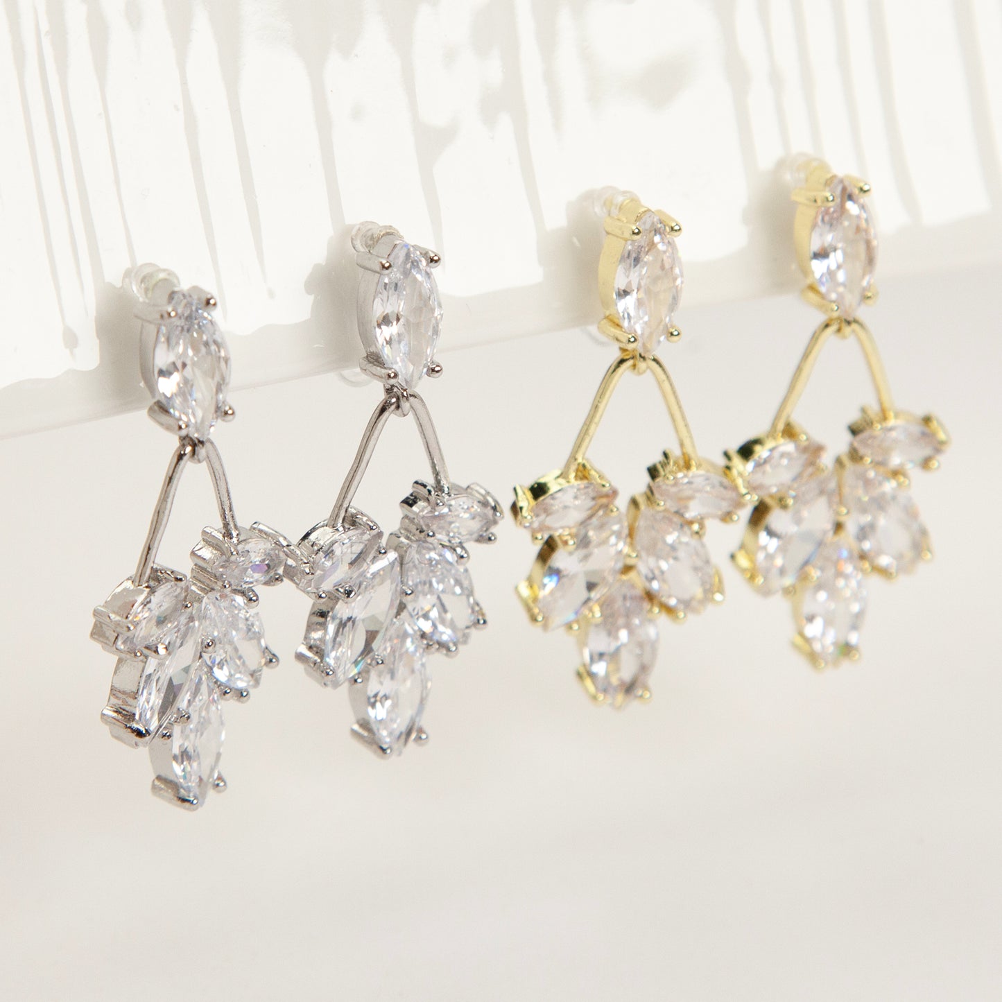 diamond drop invisible clip on earrings gold and silver brass clear resin non pierced leaf design