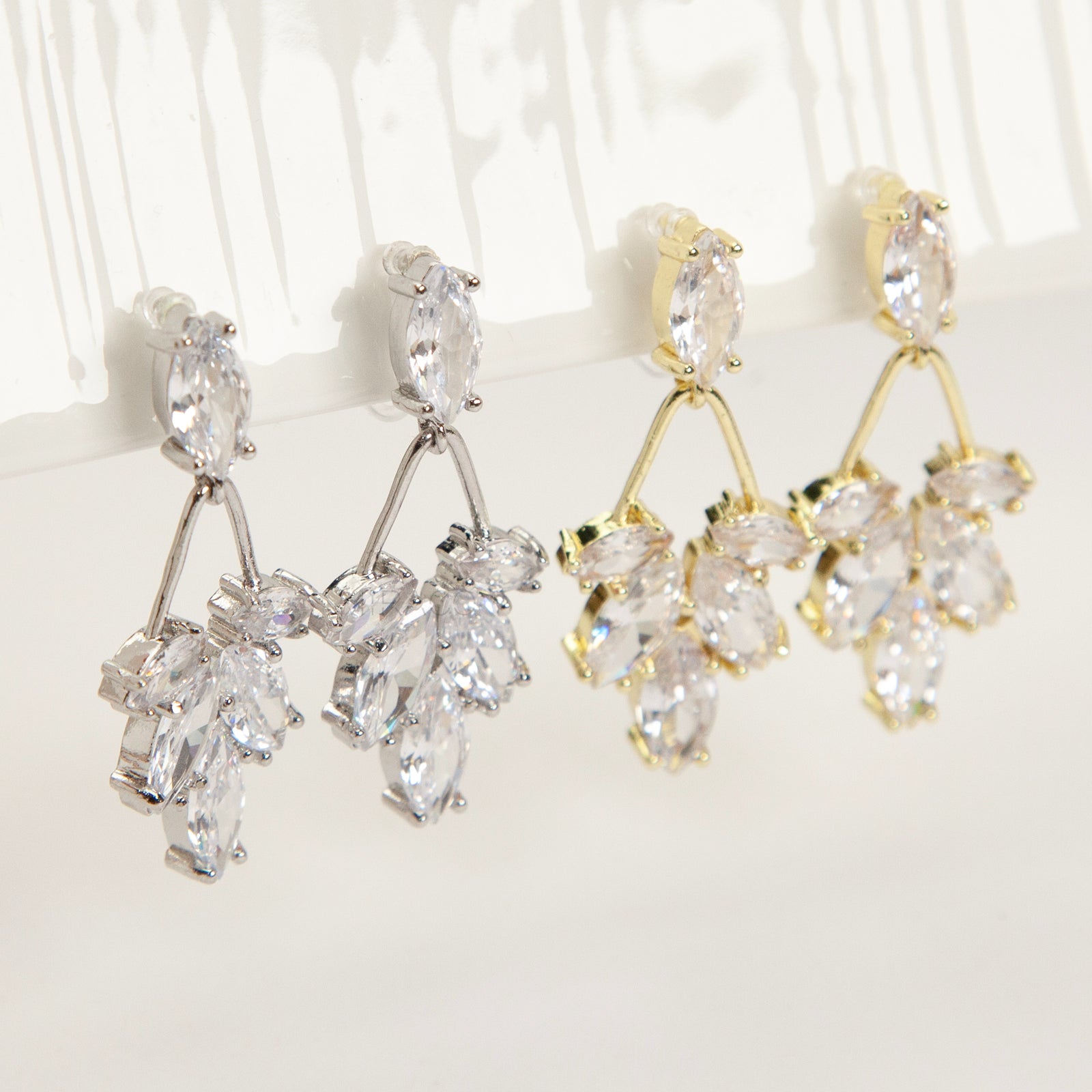 diamond drop invisible clip on earrings gold and silver brass clear resin non pierced leaf design