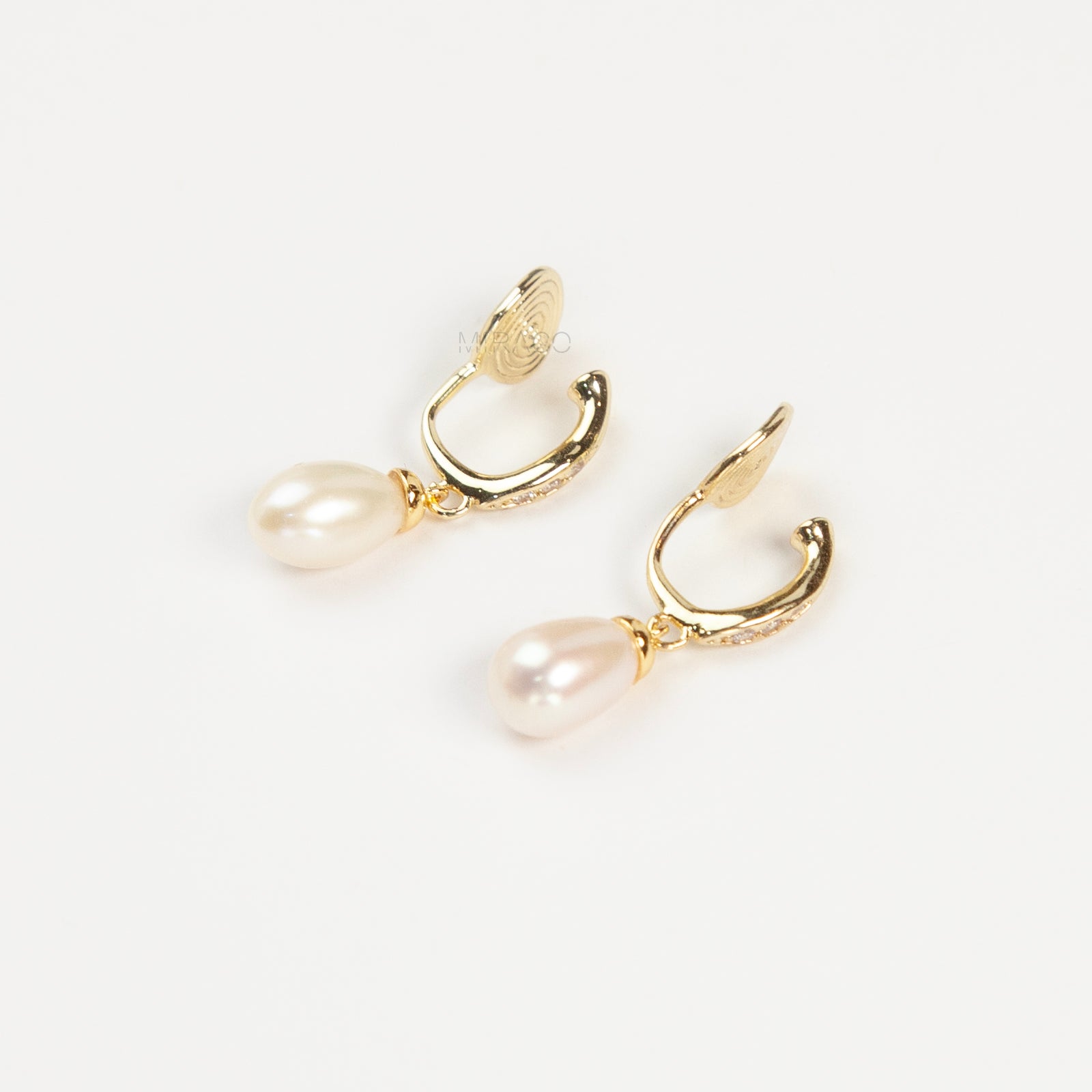 Pair of Sparkle Dangle Freshwater Pearl Clip-On Earrings with Coil Back and cubic zirconia accents.