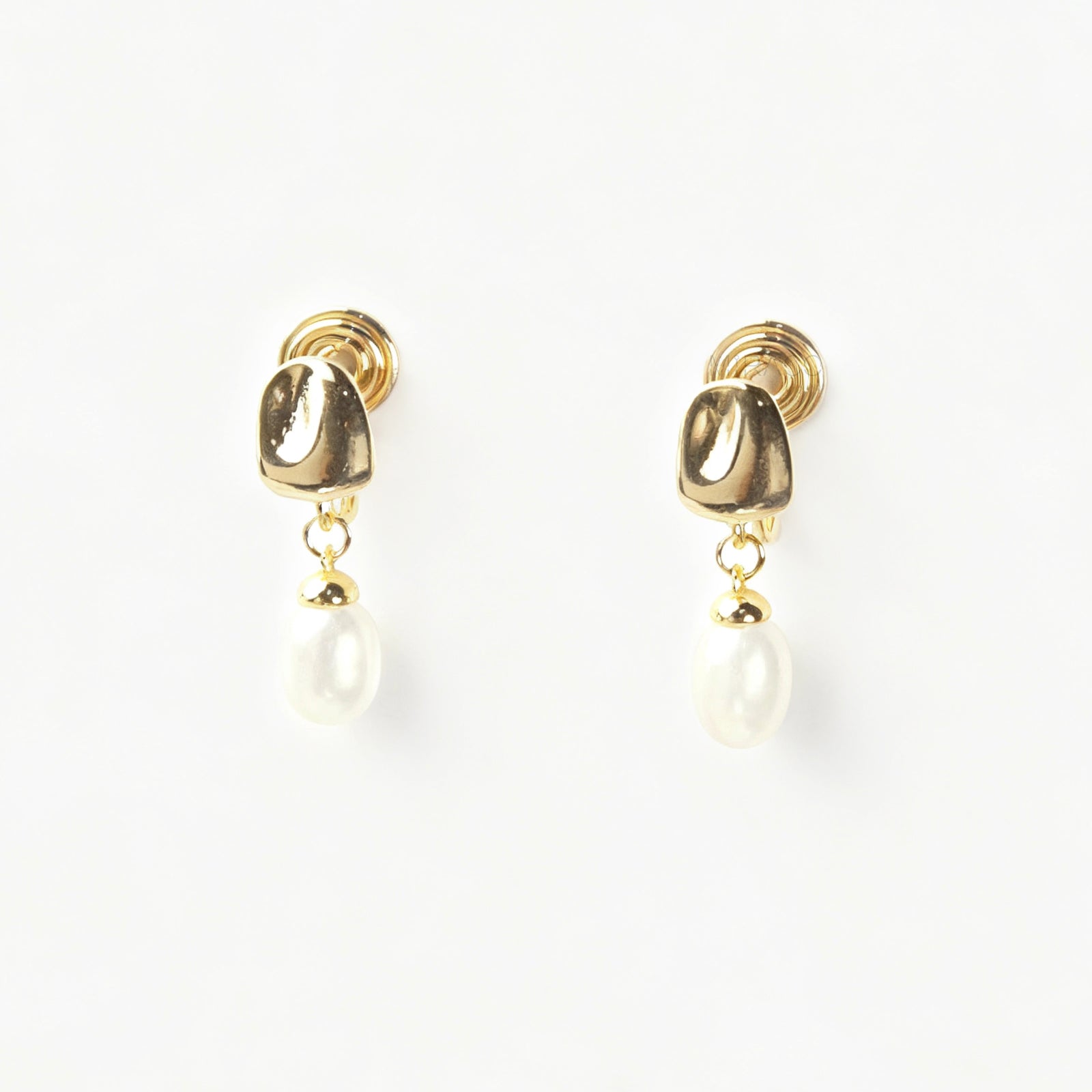 Pair of Gold-Tone Dangle Freshwater Pearl Clip-On Earrings with Coil Back closure.