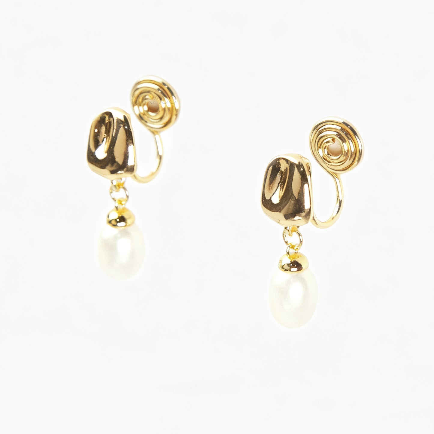 Pair of Gold-Tone Dangle Freshwater Pearl Clip-On Earrings with Coil Back closure.