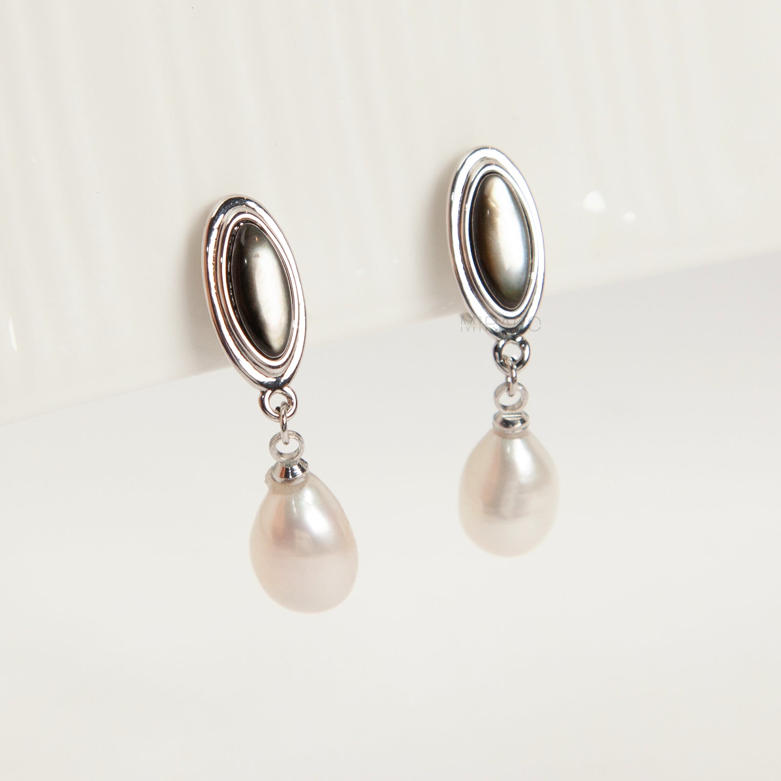 Silver oval pearl drop clip-on earrings for non-pierced ears