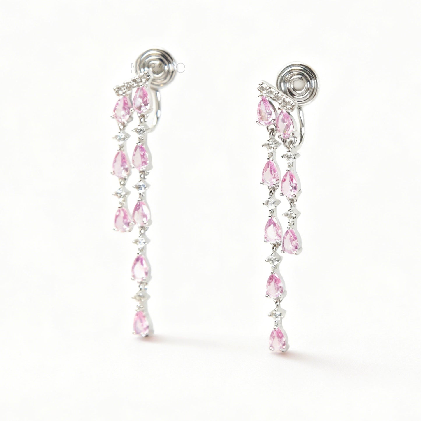 Long, silver-tone dangle clip-on earrings featuring cascading strands of clear (white) and pink pear-shaped and round-cut cubic zirconia stones.