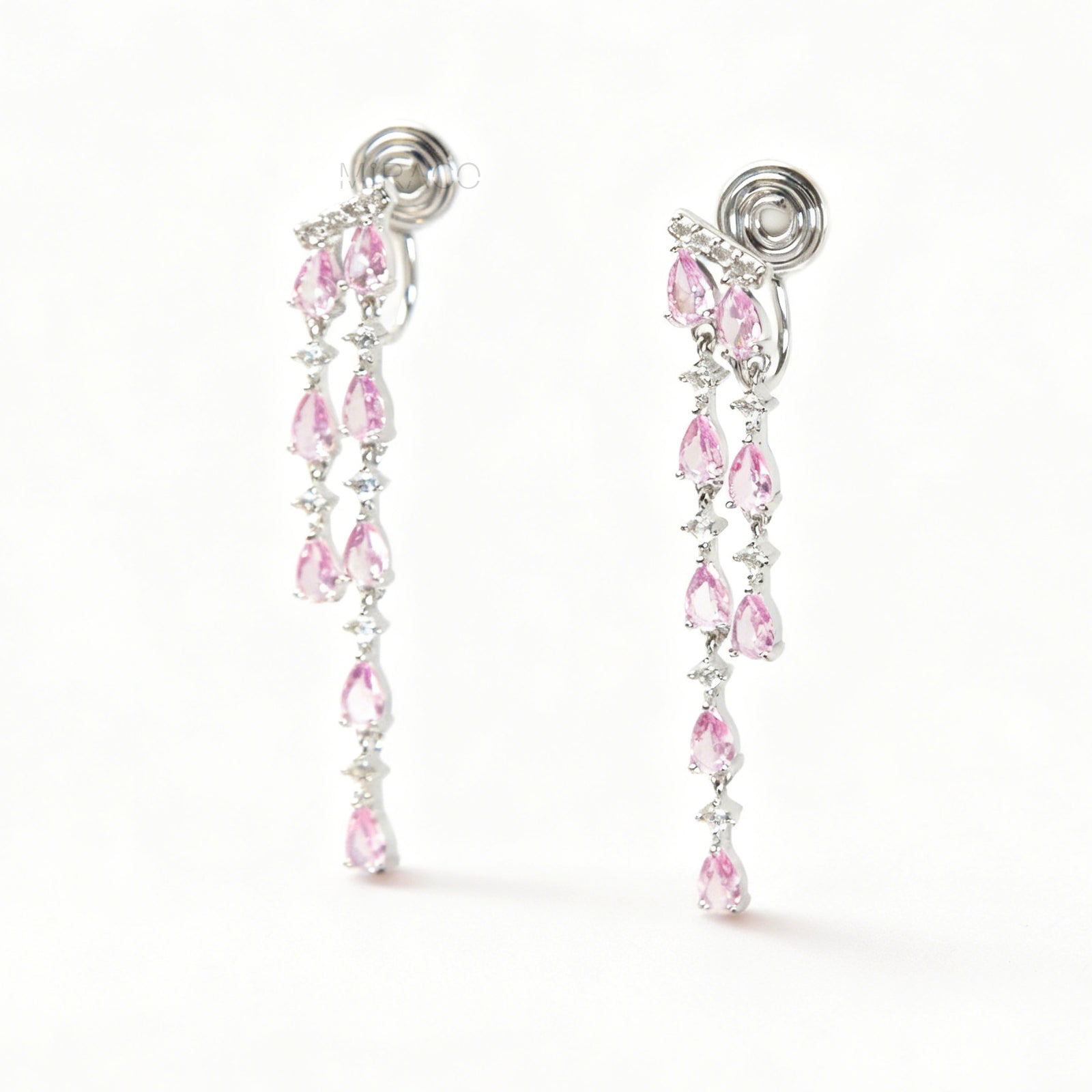 Long, silver-tone dangle clip-on earrings featuring cascading strands of clear (white) and pink pear-shaped and round-cut cubic zirconia stones.