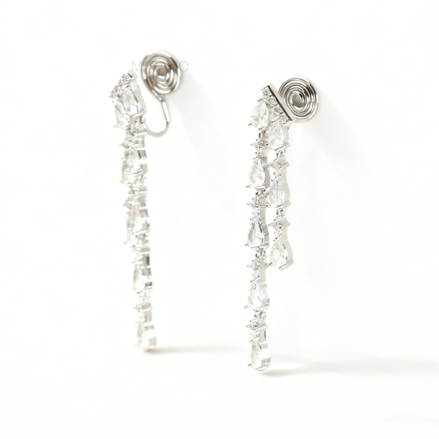 Long, silver-tone dangle clip-on earrings featuring cascading strands of clear (white) and pink pear-shaped and round-cut cubic zirconia stones.